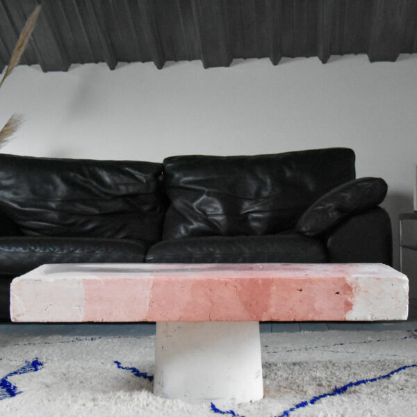 Red and white Bunkr concrete table made by Solid Studio.